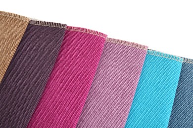 Photo of Samples of different fabrics isolated on white, top view