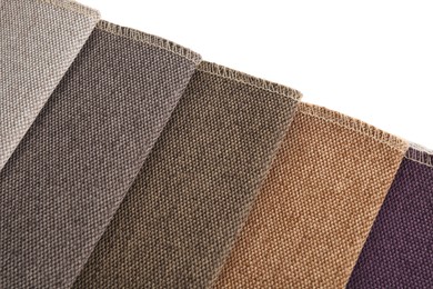 Photo of Samples of different fabrics isolated on white, top view