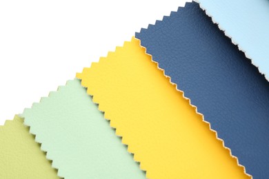 Photo of Samples of different fabrics isolated on white, top view