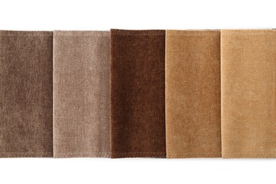 Photo of Samples of different fabrics isolated on white, top view