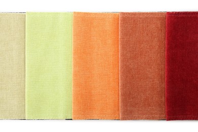 Photo of Samples of different fabrics isolated on white, top view