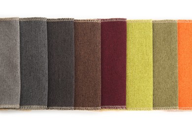 Photo of Samples of different fabrics isolated on white, top view