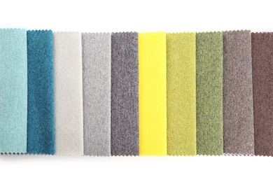 Photo of Samples of different fabrics isolated on white, top view