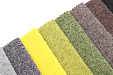 Photo of Samples of different fabrics isolated on white, top view