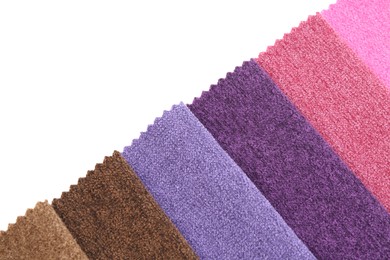 Photo of Samples of different fabrics isolated on white, top view