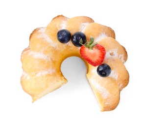 Photo of Tasty bundt cake with powdered sugar and berries isolated on white, top view