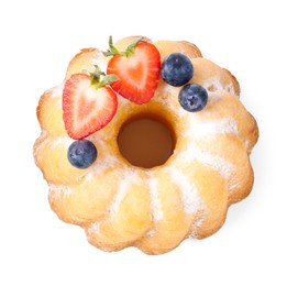 Photo of Tasty bundt cake with powdered sugar and berries isolated on white, top view