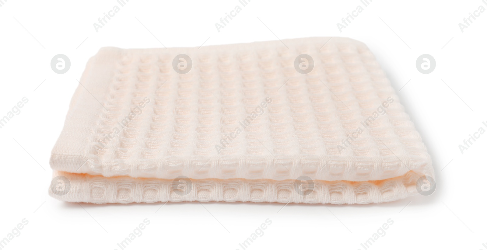 Clean beige waffle towel isolated on white Photo of Clean beige waffle towel isolated on white