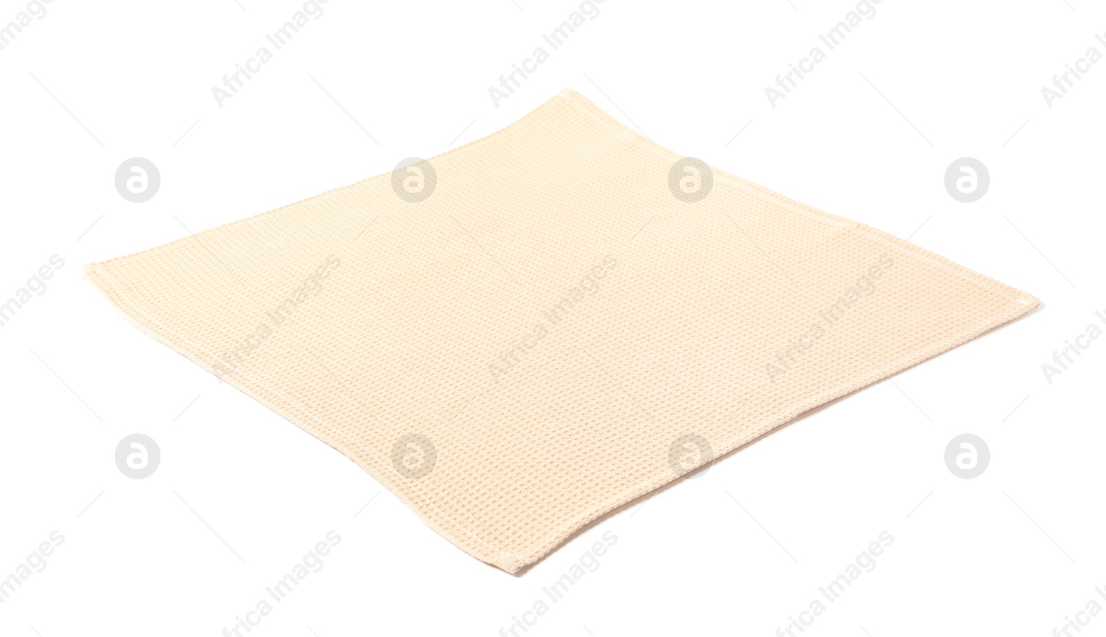 Clean beige waffle towel isolated on white Photo of Clean beige waffle towel isolated on white