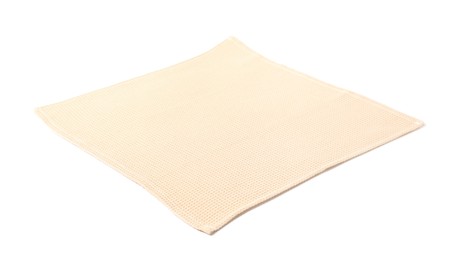 Photo of Clean beige waffle towel isolated on white