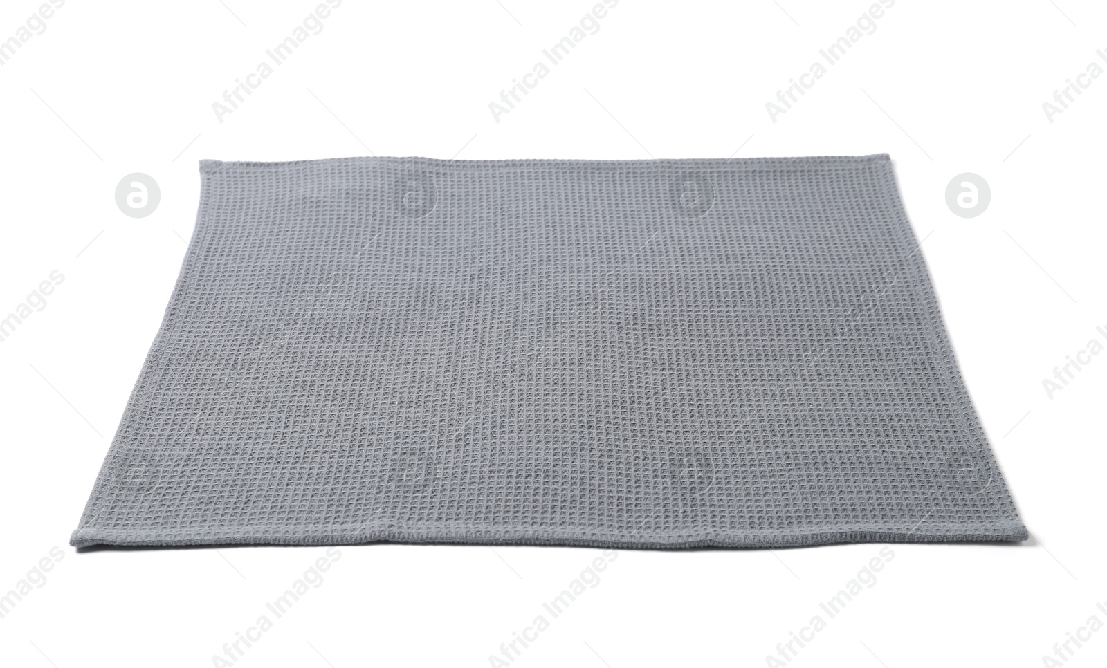 Clean grey waffle towel isolated on white Photo of Clean grey waffle towel isolated on white