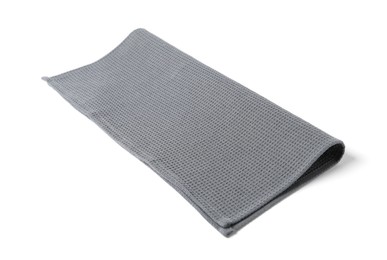Photo of Clean grey waffle towel isolated on white