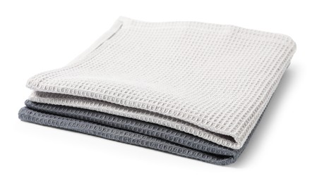 Photo of Two clean waffle towels isolated on white
