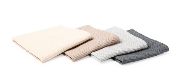 Photo of Many clean waffle towels isolated on white