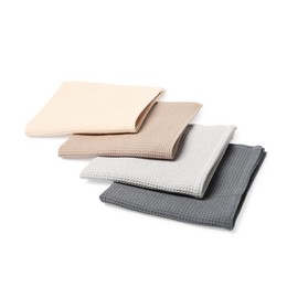 Photo of Many clean waffle towels isolated on white