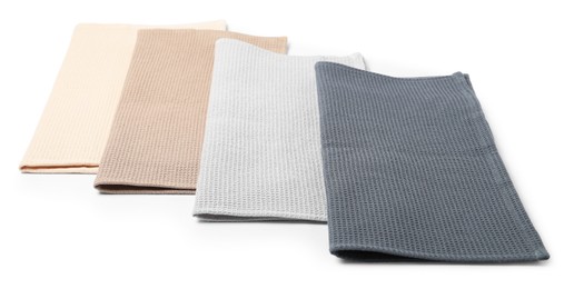 Photo of Many clean waffle towels isolated on white