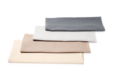 Photo of Many clean waffle towels isolated on white