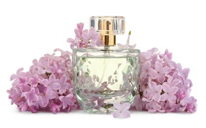 Photo of Luxury perfume and beautiful lilac flowers isolated on white