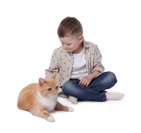 Photo of Little boy with her cute ginger cat on white background