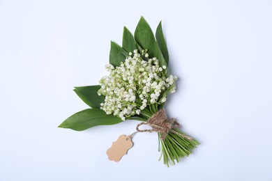 Photo of Beautiful lily-of-the-valley flowers on white background, top view