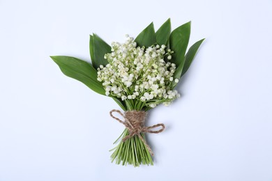Photo of Beautiful lily-of-the-valley flowers on white background, top view