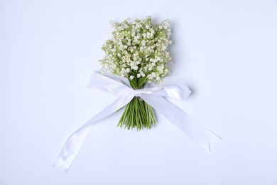 Photo of Beautiful lily-of-the-valley flowers on white background, top view