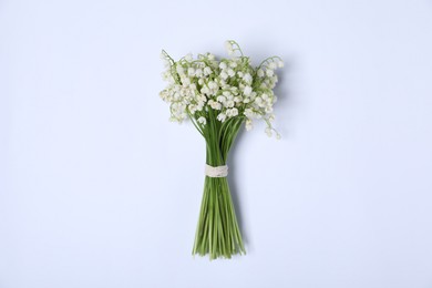 Photo of Beautiful lily-of-the-valley flowers on white background, top view