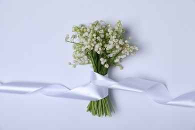 Photo of Beautiful lily-of-the-valley flowers on white background, top view