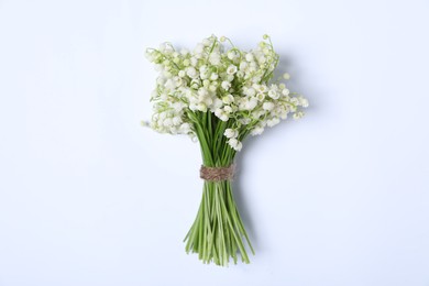 Photo of Beautiful lily-of-the-valley flowers on white background, top view