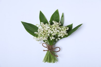 Photo of Beautiful lily-of-the-valley flowers on white background, top view