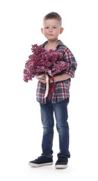 Photo of Little boy with bouquet of lilac flowers on white background