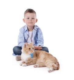 Photo of Little boy with her cute ginger cat on white background