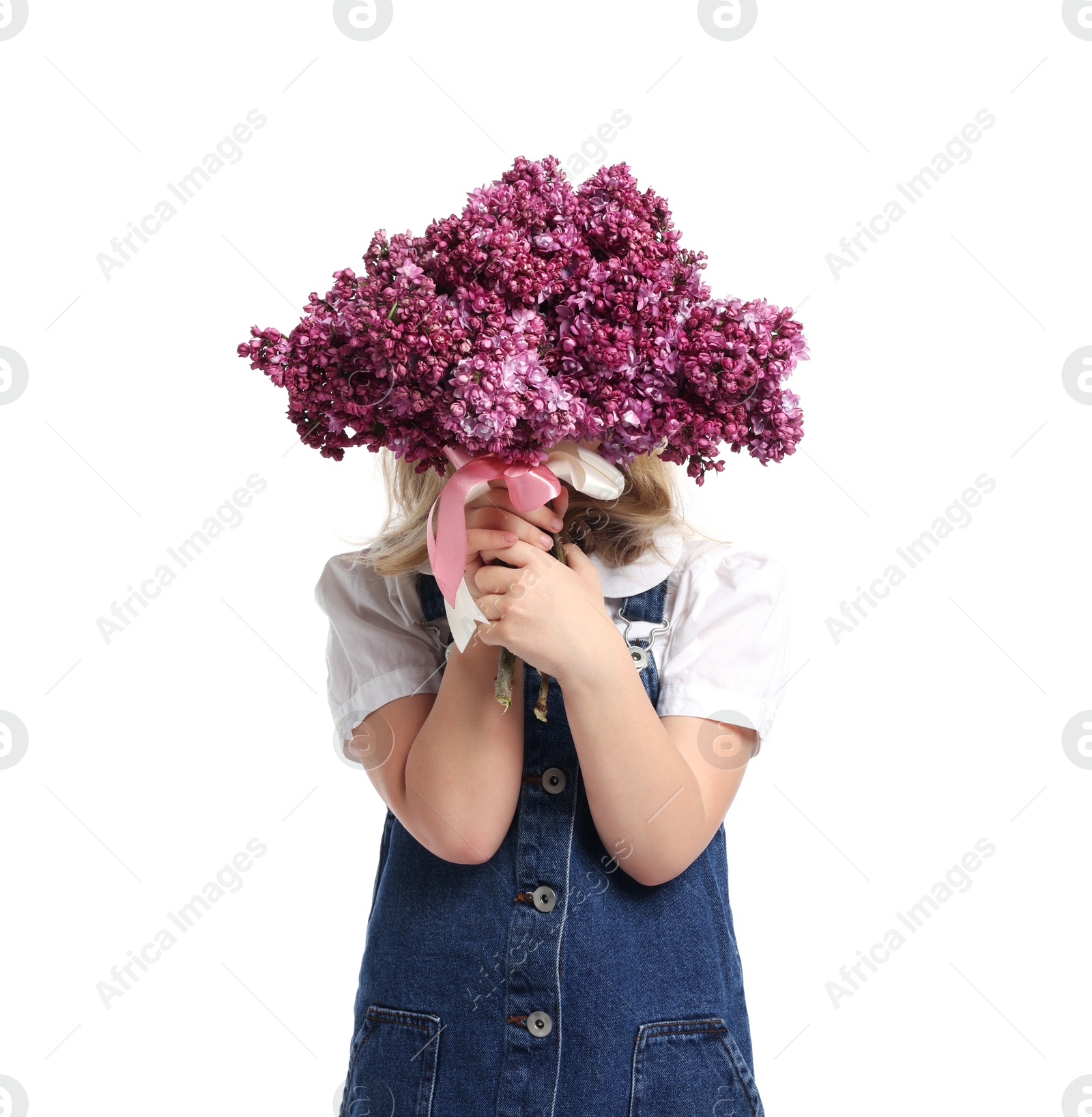Little girl with bouquet of lilac flowers on white background Photo of Little girl with bouquet of lilac flowers on white background