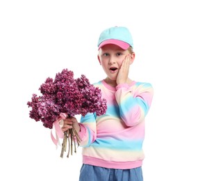 Photo of Surprised little girl with bouquet of lilac flowers on white background