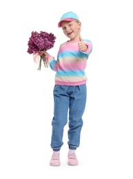 Photo of Little girl with bouquet of lilac flowers showing thumbs up on white background