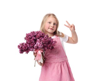 Photo of Little girl with bouquet of lilac flowers showing V-sign on white background