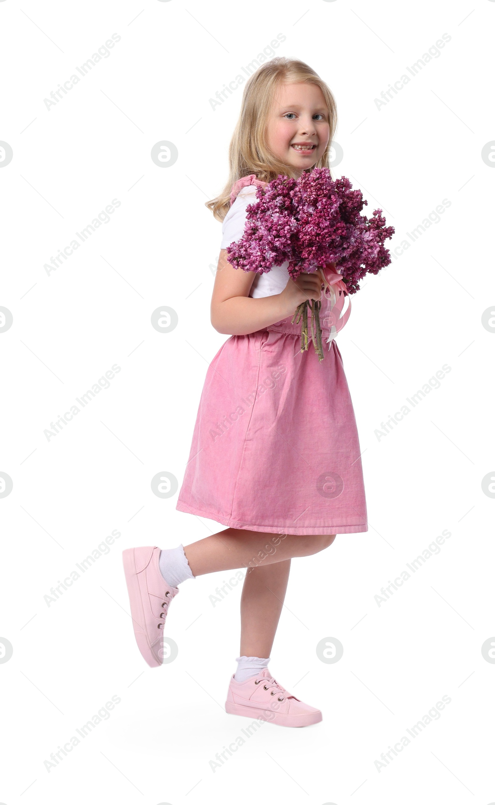 Little girl with bouquet of lilac flowers on white background Photo of Little girl with bouquet of lilac flowers on white background