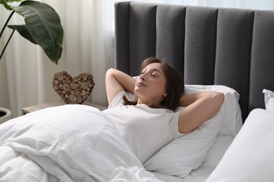 Photo of Beautiful woman sleeping in bed at home