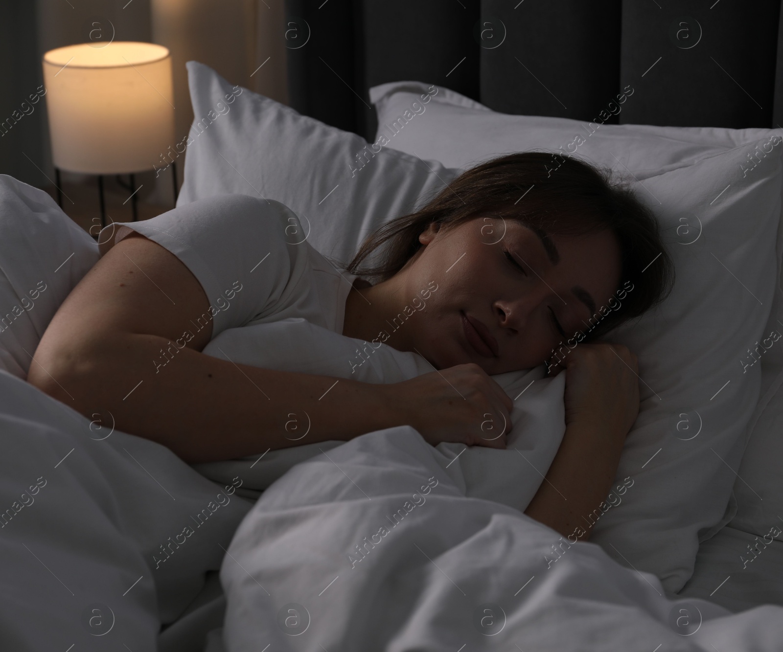 Beautiful woman sleeping in bed at home Photo of Beautiful woman sleeping in bed at home