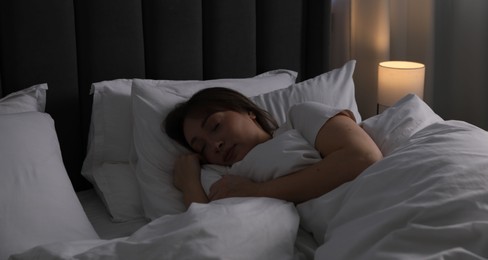 Photo of Beautiful woman sleeping in bed at home