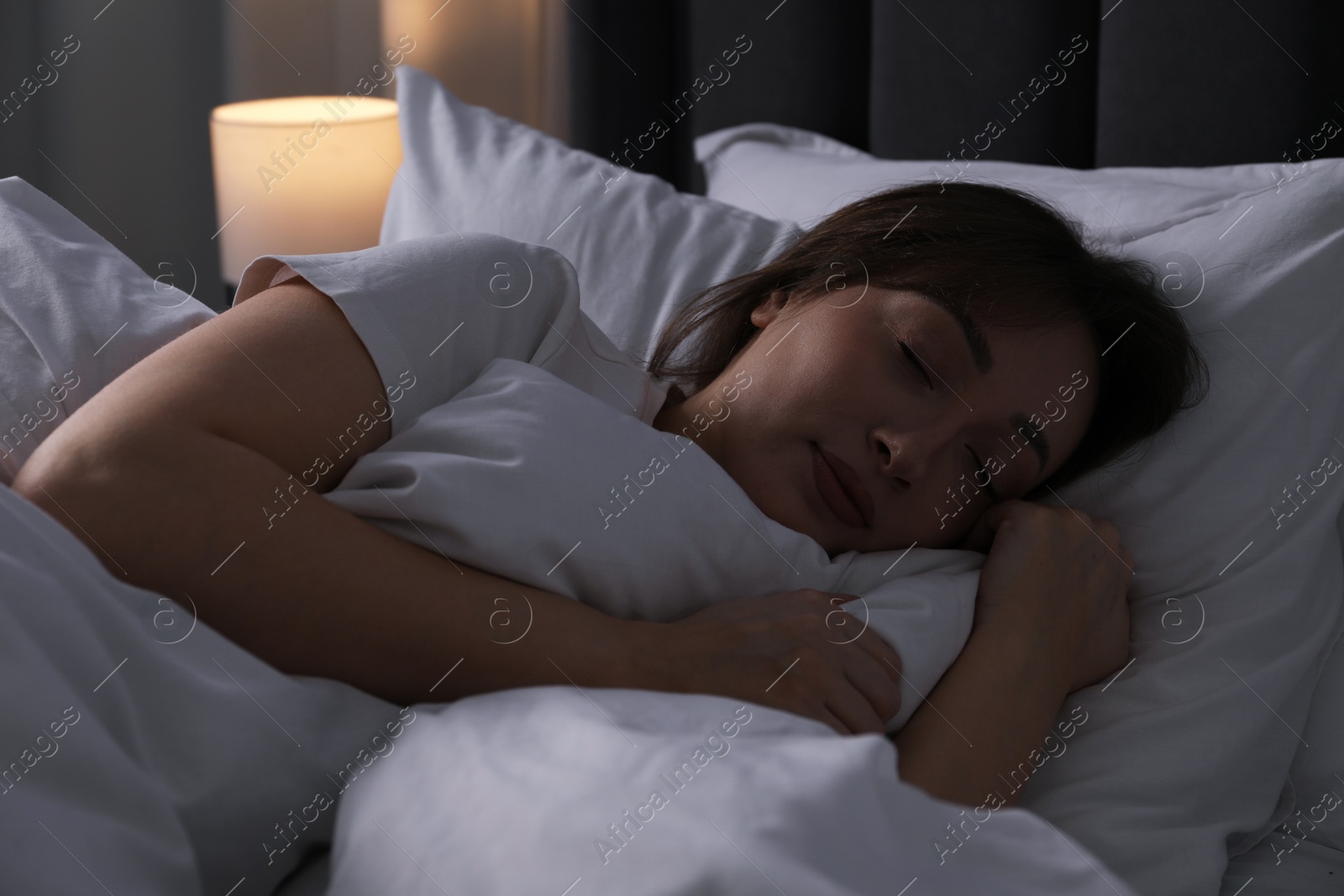 Beautiful woman sleeping in bed at home Photo of Beautiful woman sleeping in bed at home
