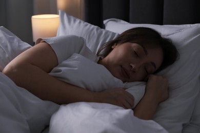 Photo of Beautiful woman sleeping in bed at home