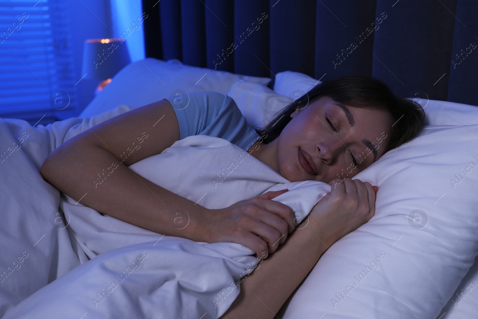 Beautiful woman sleeping in bed at home Photo of Beautiful woman sleeping in bed at home