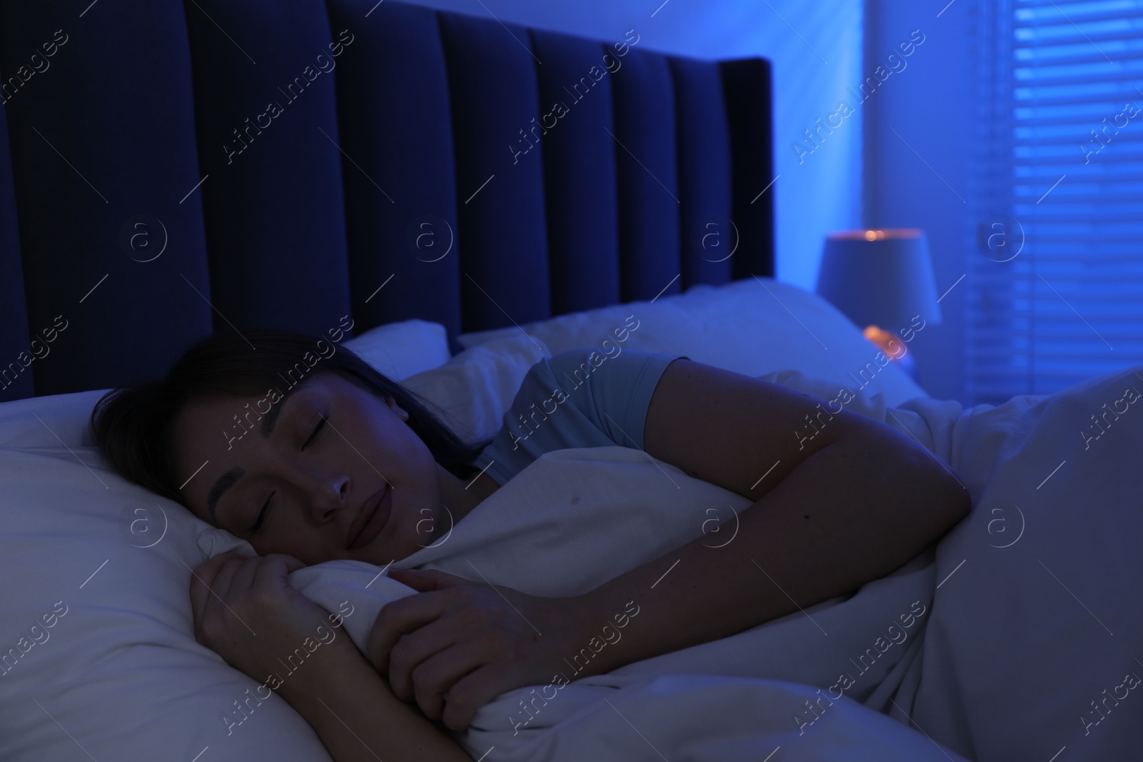 Beautiful woman sleeping in bed at home Photo of Beautiful woman sleeping in bed at home
