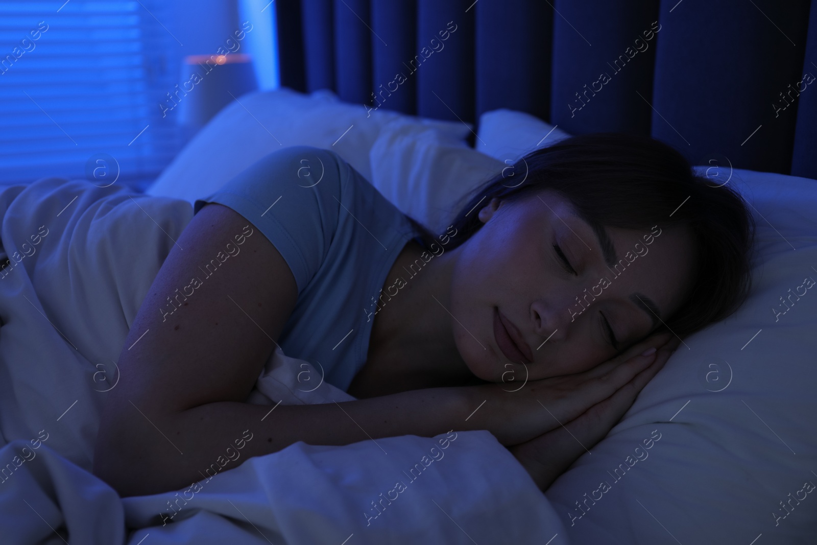 Beautiful woman sleeping in bed at home Photo of Beautiful woman sleeping in bed at home