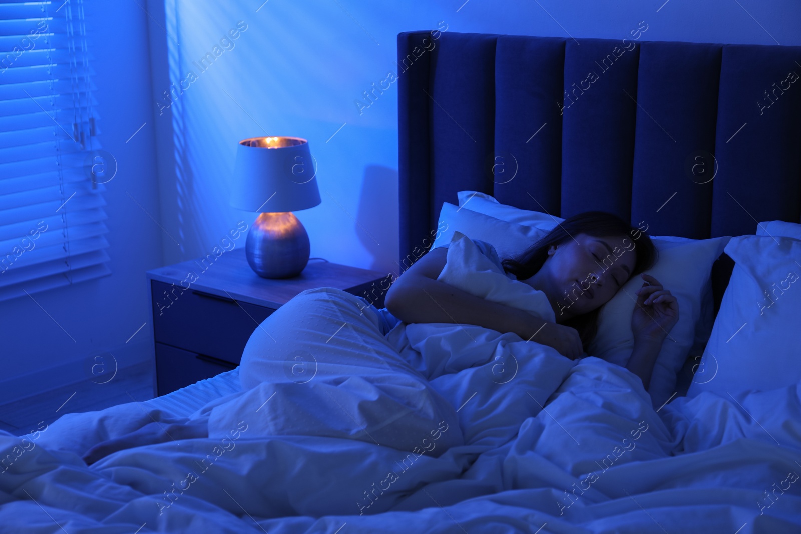 Beautiful woman sleeping in bed at home Photo of Beautiful woman sleeping in bed at home