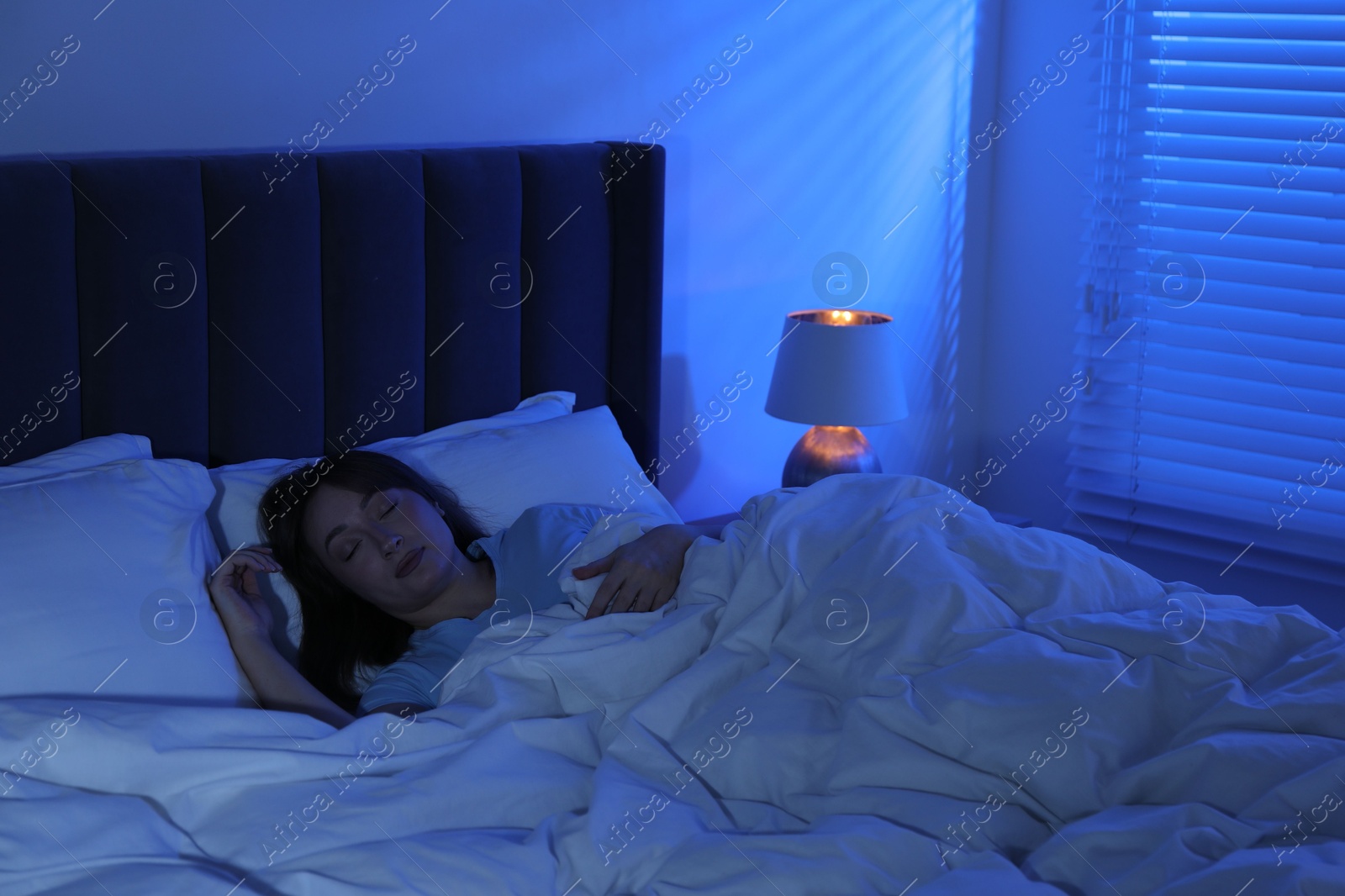 Beautiful woman sleeping in bed at home Photo of Beautiful woman sleeping in bed at home