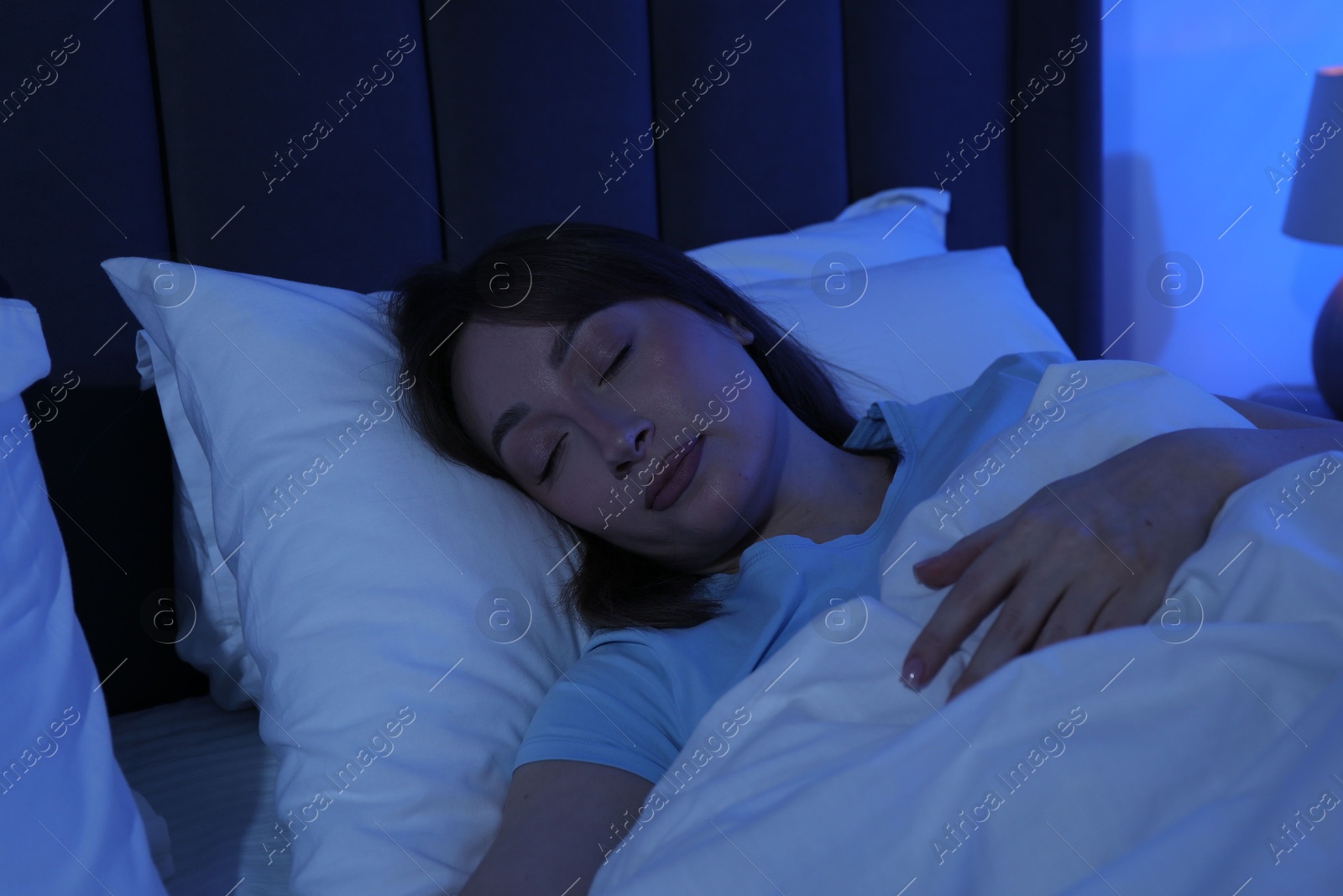 Beautiful woman sleeping in bed at home Photo of Beautiful woman sleeping in bed at home