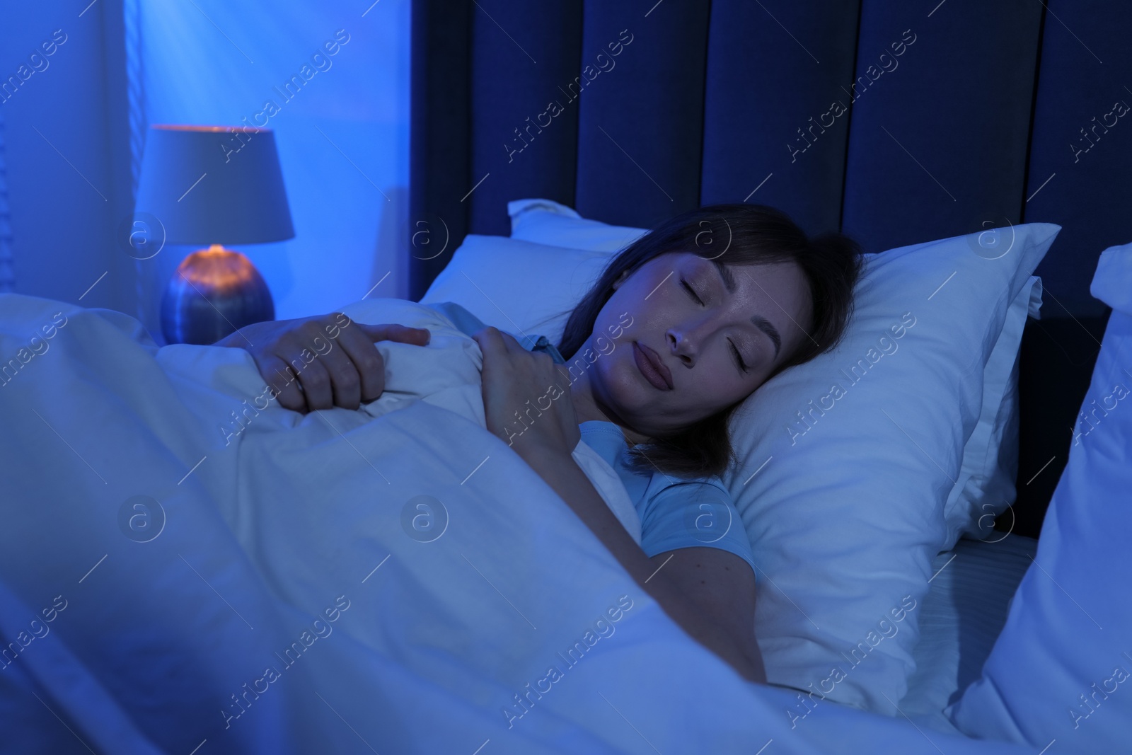 Beautiful woman sleeping in bed at home Photo of Beautiful woman sleeping in bed at home