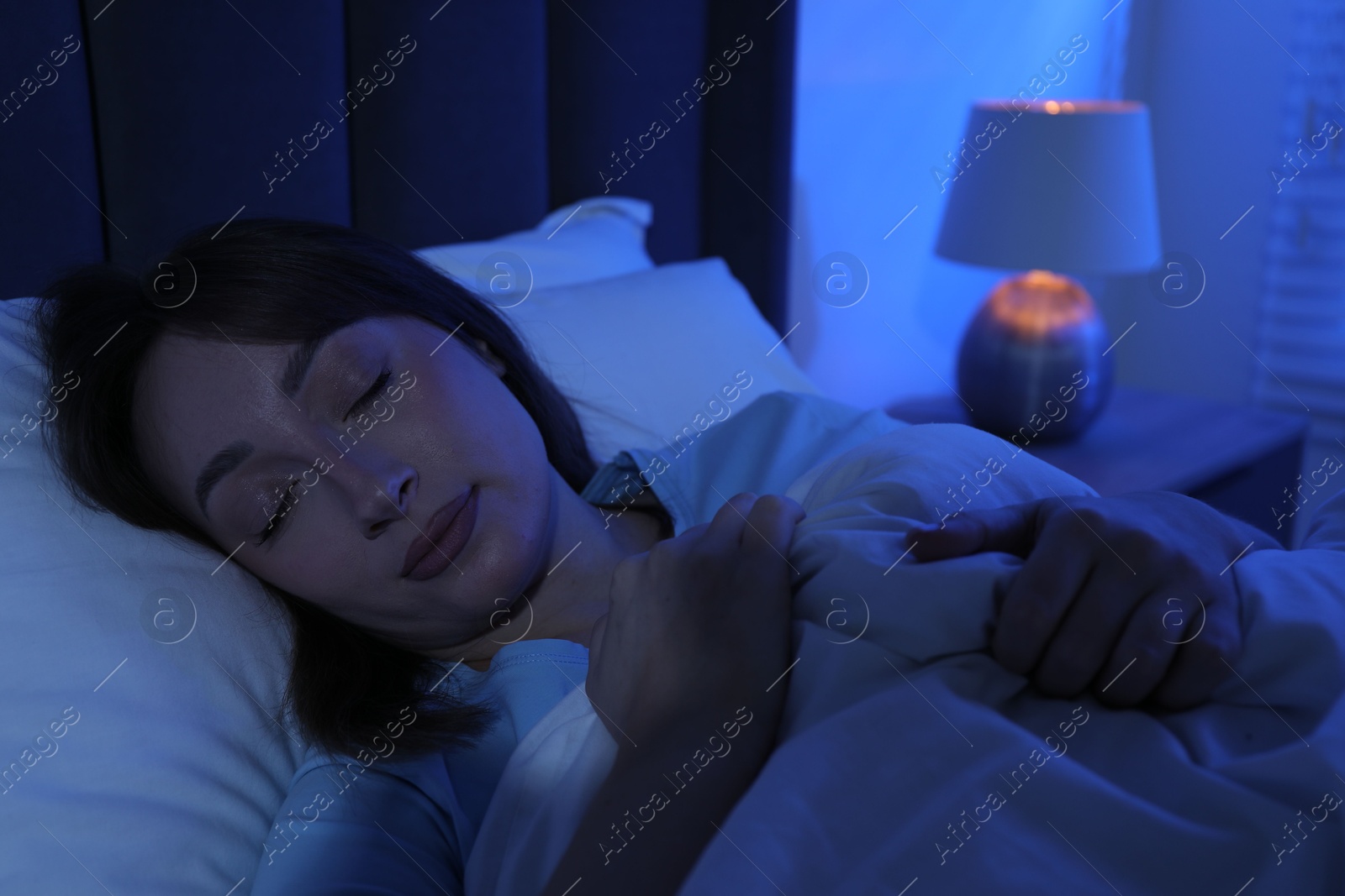 Beautiful woman sleeping in bed at home Photo of Beautiful woman sleeping in bed at home